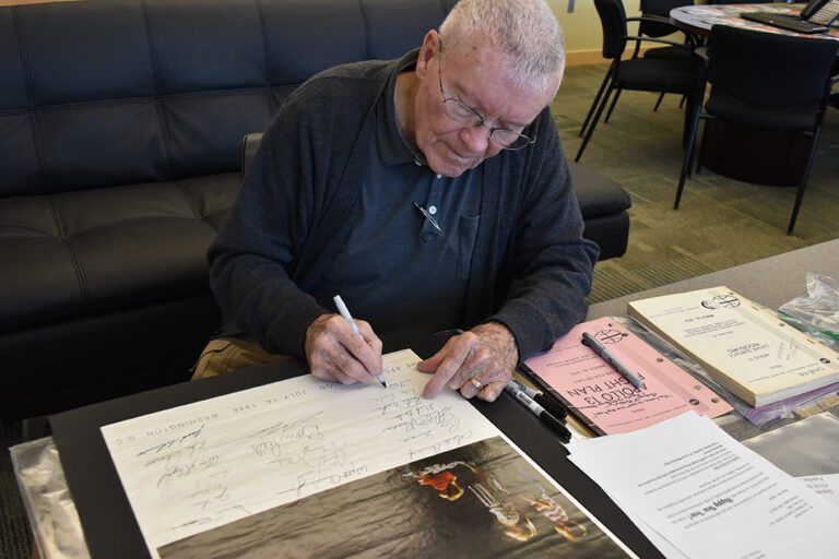 Fred Haise giving autograph picture